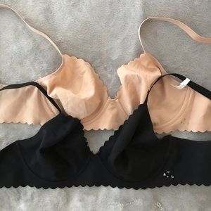 Aerie T-shirt bras with underwire, one nude and one black.